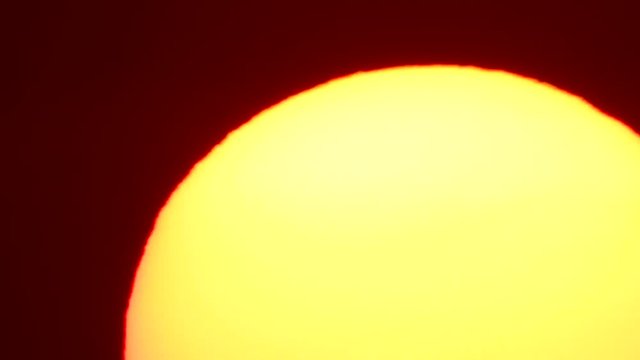 huge setting sun in the evening
