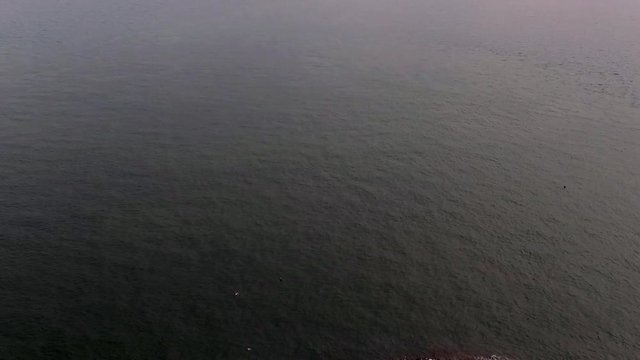 Thirty-second clip of a drone coming in to land on a small lighthouse island.
