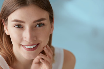 Beauty portrait of smiling woman with white teeth smile