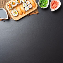 Japanese sushi served on stone background. Top view