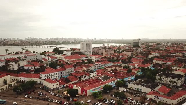 Aerial view Market of Tulhas and historical buildings decorated by the government with flags of sao joao in the center of the city of sao luis do maranhao, brazil.