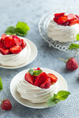 Pavlova cakes with fresh strawberry, seective focus