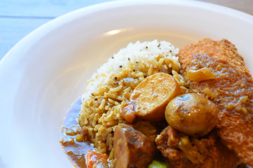 Curry fish and potatoes close up