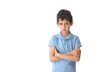 Sad boy in t-shirt. Isolated over white background. Schoolboy. Teenager.