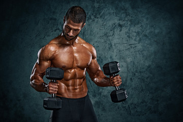 Fototapeta na wymiar Muscular Men Lifting Weights. Studio Shot