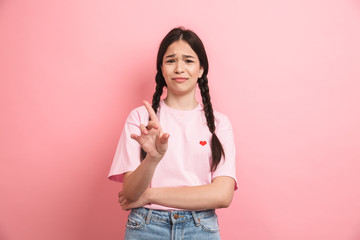 Image of brunette attractive girl with two braids rejecting and showing stop finger