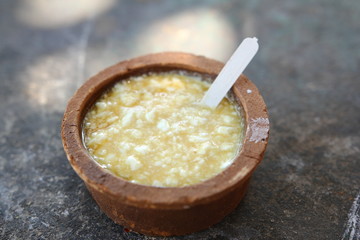 Sri lanka traditional food - curd with honey in clay pott.