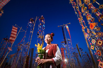 Portrait of a smiling woman in a traditional Thai costume, Bangkok, Thailand