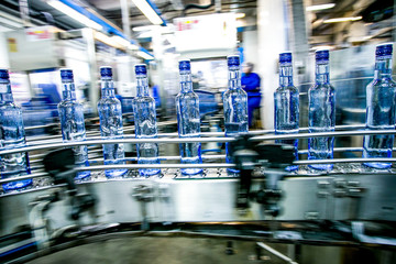 Many bottles on conveyor belt