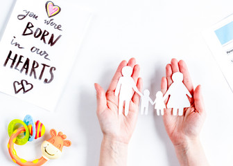 family concept with figures on desk top view mock up