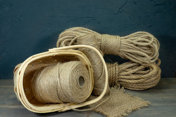 Jute rope and spools of burlap threads or twine