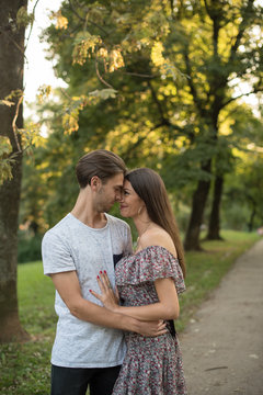 Smiling couple standing in a park, Bosnia and Herzegovina