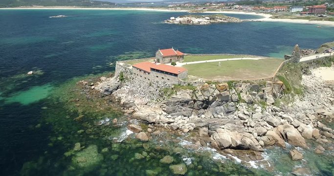 AERIAL PAN of Ermita De La Lanzada in Spain