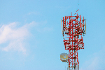 Wireless Communication Antenna Transmitter. Telecommunication tower with antennas on blue sky...