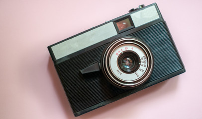 Film retro camera on a pink background 2