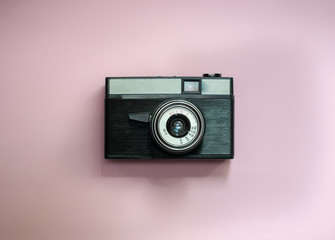 Film retro camera on a pink background 4
