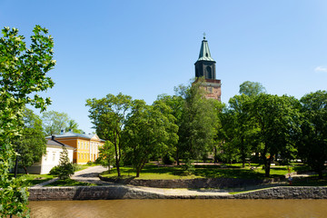 Fototapeta premium Auraioki River and view of the historic 13th century cathedral in Turku Abo on a summer day in Finland.