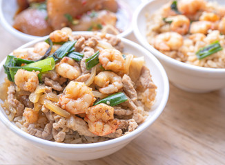 Braised shrimp over rice - Taiwan famous traditional street food. Soy-stewed prawn on cooked rice. Travel concept, top view, copy space, close up