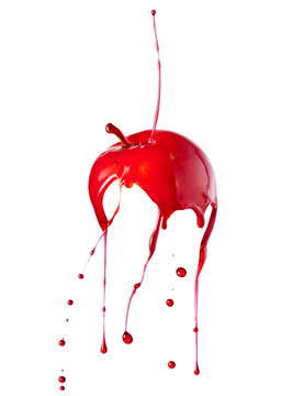 candy apple with splashing red liquid