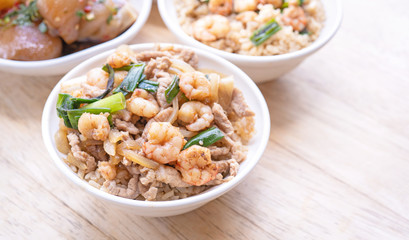Braised shrimp over rice - Taiwan famous traditional street food. Soy-stewed prawn on cooked rice. Travel concept, top view, copy space, close up