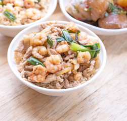 Braised shrimp over rice - Taiwan famous traditional street food. Soy-stewed prawn on cooked rice. Travel concept, top view, copy space, close up