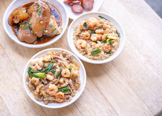 Braised shrimp over rice - Taiwan famous traditional street food. Soy-stewed prawn on cooked rice. Travel concept, top view, copy space, close up