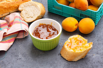 breakfast with apricot jam and slice of bread