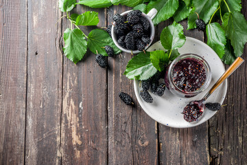 Mulberry Chutney or Jam, with fresh Mulberries, wooden rustic background