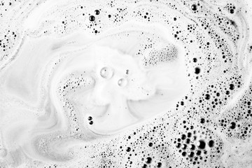 Dissolving bath bomb in the tub water with foam