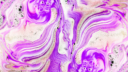 Dissolve of pink and purple bath bomb background