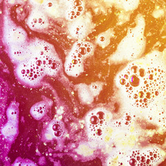 Yellow and red bath bomb bubble surface with bubble