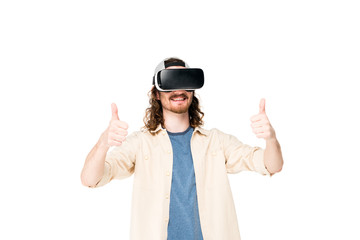 young man using VR headset showing thumb up at camera isolated on white