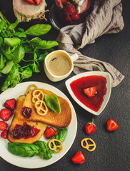 Toast, strawberry jam and coffee - breakfast (tasty snack with basil, dessert). food background. top view. copy space