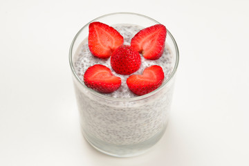 Chia pudding with strawberry on a white background. Space for text or design.