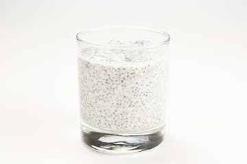 Chia pudding  in glass on a white background. Space for text or design.