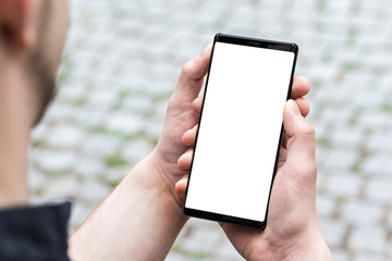 Man using mobile smart phone, close up.