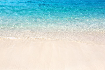 Fototapeta na wymiar Wave of the sea on the sand beach.