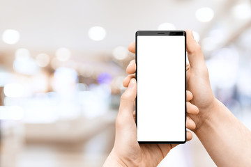 Hand holding mobile smart phone with blank screen