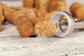 Cork screw for wine and corks close up