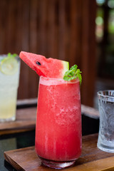 fresh watermelon smoothie and mint leaves