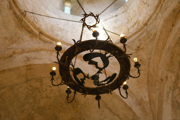 Fototapeta na wymiar Ancient chandelier in the Albanian church temple in Kish province of Azerbaijan. Dome of the church in the village of Kish