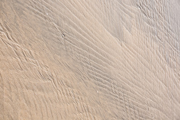 Fototapeta na wymiar drawings and footprints in the sand