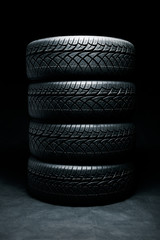 Fototapeta na wymiar New tyres background. Car tyres close up