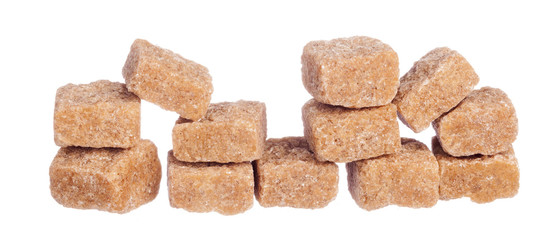 Brown cane sugar cubes isolated on white background