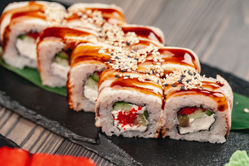 Sushi served on a slate plate in a restaurant