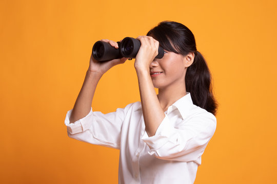 Young Asian Woman With Binoculars.