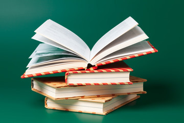 books isolated on green background