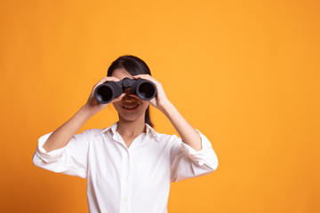 Young Asian woman with binoculars.