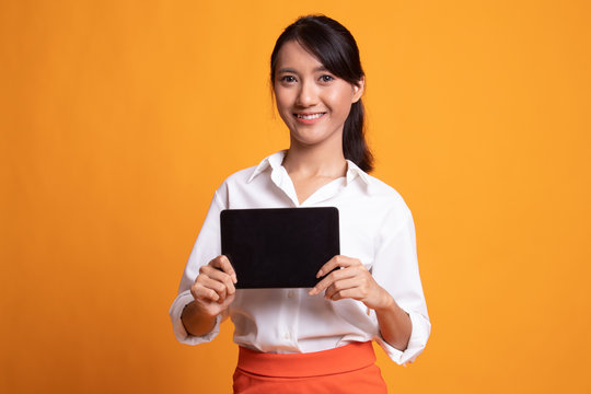 Young Asian woman with a computer tablet.