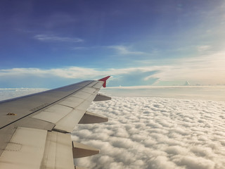 Fototapeta na wymiar Selective focus blue sky and clouds from airplane window.